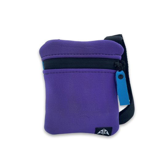 Flat crossbody bag with zipped opening, adjustable strap, made from recycled neoprene in purple with blue zip pull.