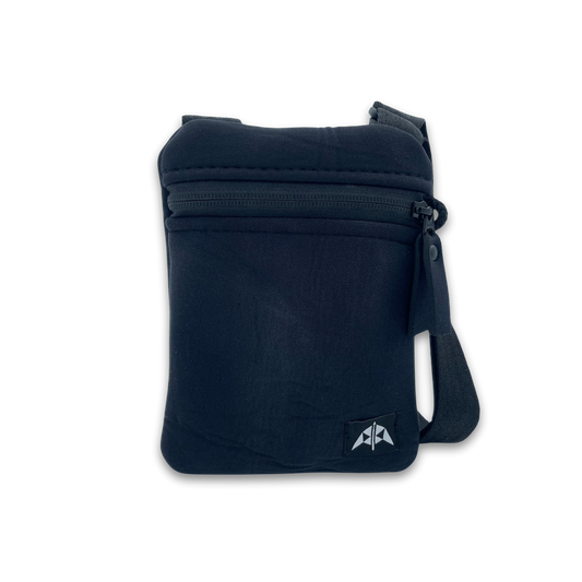 Flat crossbody bag with zipped opening, adjustable strap, made from recycled wetsuits in black.