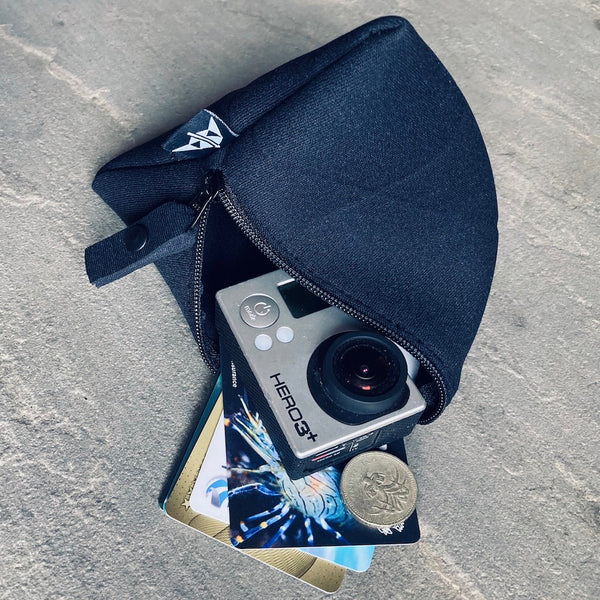 Trinity neoprene pyramid-shaped pouch, large in black with cards, coins and camera inside