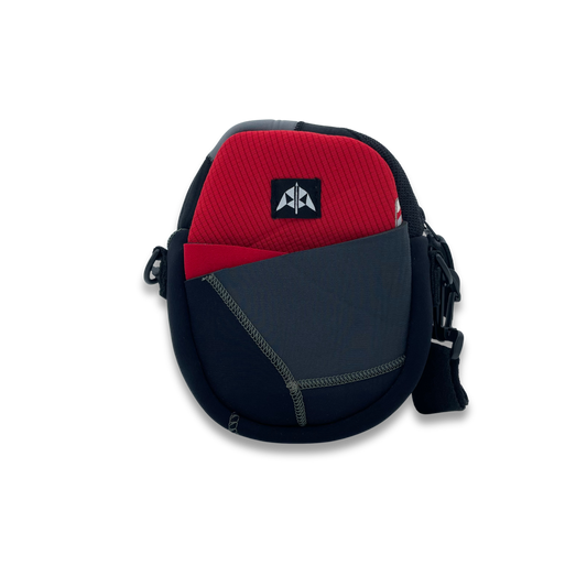 Crossbody bag with zipped closure, removable & adjustable strap, slip pocket at front, made from neoprene recycled from wetsuits in red, grey & black.