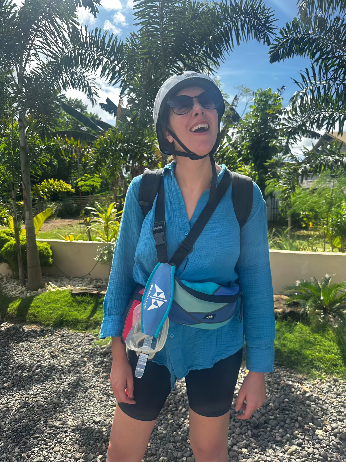 Recycled Sling / Bum Bag and scuba mask strap cover being worn with trees in the background. 
