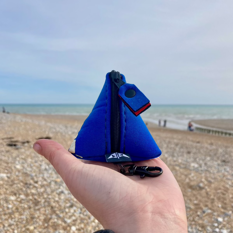 Recycled pyramid keyring pouch in blue with shoreline background