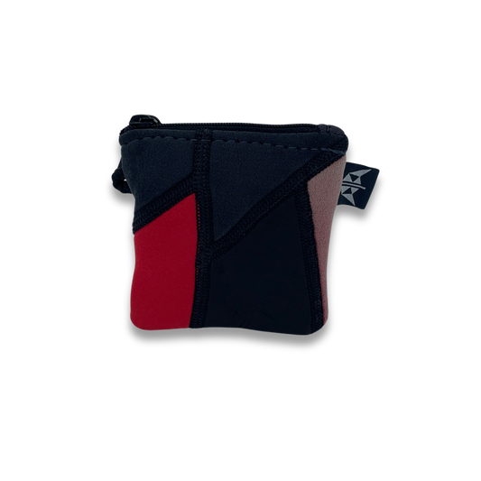 Recycled wetsuit coin pouch with zipped closure and security loop. Made from recycled wetsuits in red and black.