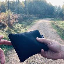 Load image into Gallery viewer, Earthbound Rectangle Neoprene Pouch in Black on a woodland walk
