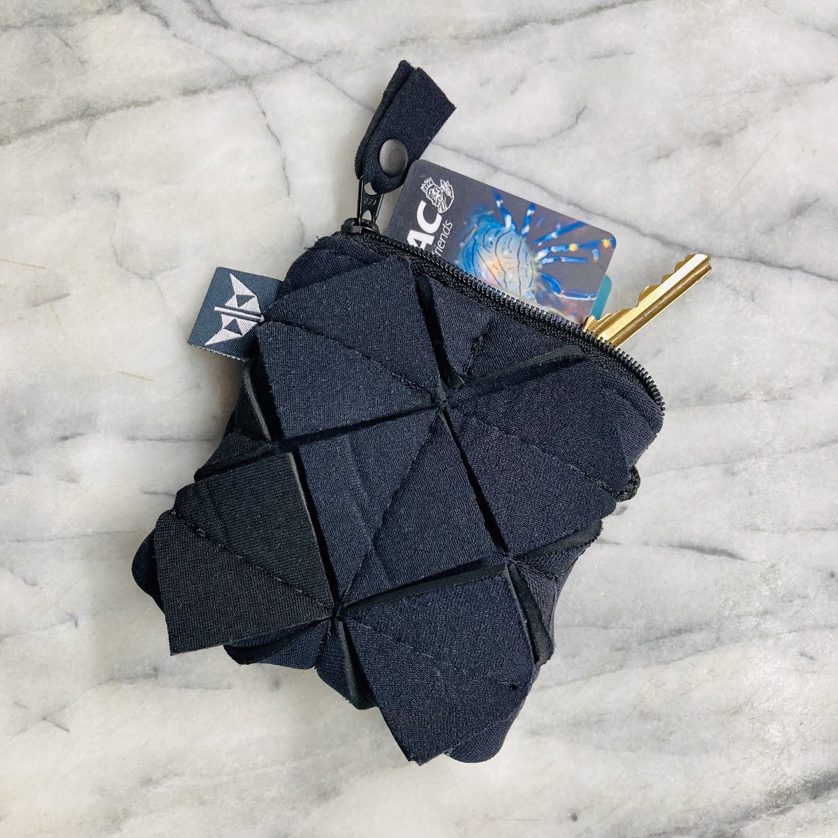 Recycled Geometric Square Coin Purse with zipped closure and loop. Made from recycled wetsuits. 